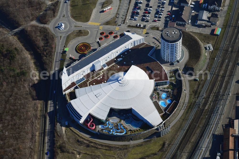 Pratteln from the bird's eye view: Building, pools and water slide of Water World Aquabasilea in Pratteln in the canton Basel-Landschaft, Switzerland. The round building in the neighborhood is the corporate headquarter of Clariant AG