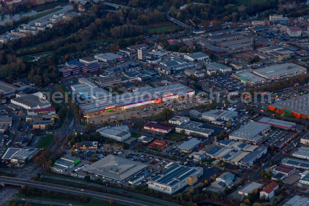 Schweinfurt from above - Building of the construction market BAUHAUS Schweinfurt and Marktkauf Schweinfurt at dusk in Schweinfurt in the state Bavaria, Germany