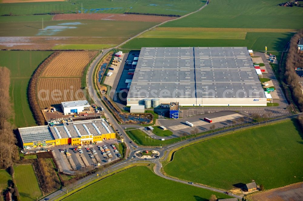 Aerial photograph Emmerich am Rhein - Building of the construction market of OBI GmbH & Co. KG Germany and the BLG Retail Logistics GmbH & Co.KG in commercial and industrial area at the Weseler Strasse in Emmerich am Rhein in North Rhine-Westphalia