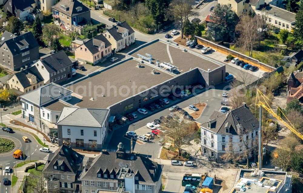 Witten from the bird's eye view: Building of the shopping center Edeka - Familie Gruetter & Team on Wittener Str in the district Herbede in Witten in the state North Rhine-Westphalia