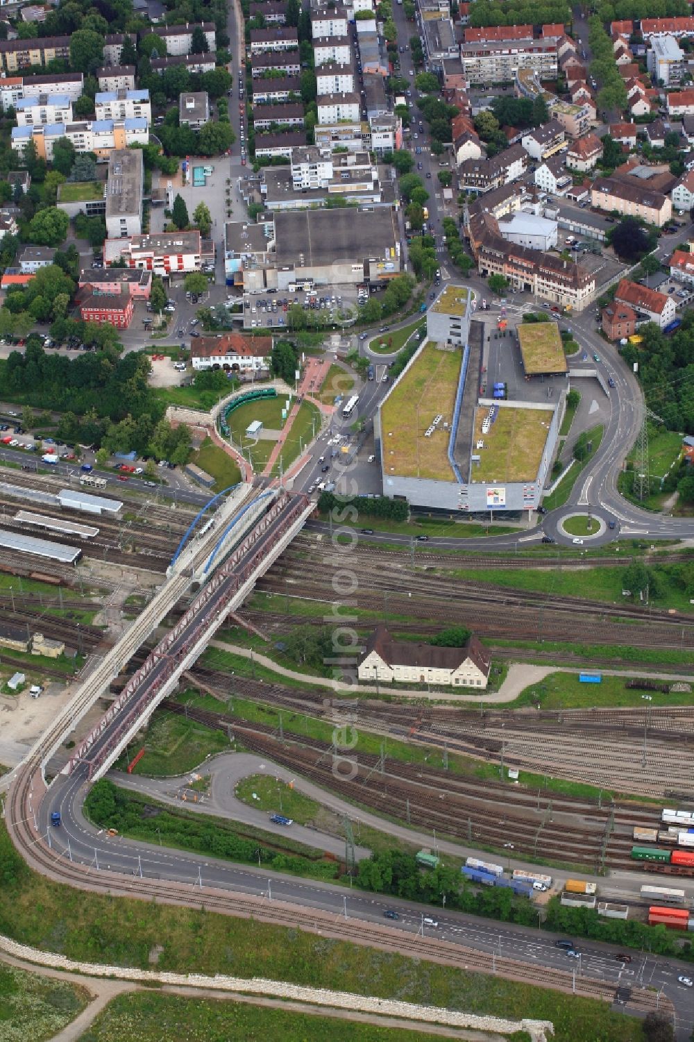 Weil am Rhein from the bird's eye view: Building of the shopping center Insel, Peace Bridge, tram terminal stop and station in Weil am Rhein in the state Baden-Wuerttemberg