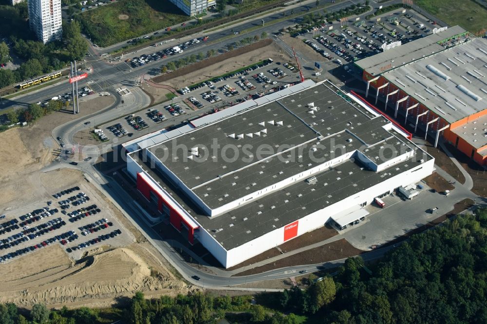 Aerial image Berlin - Building of the shopping center of Hoeffner Moebelgesellschaft GmbH & Co.KG and of Krieger-Gruppe on Landsberger Allee in Berlin Lichtenberg in the state Berlin, Germany