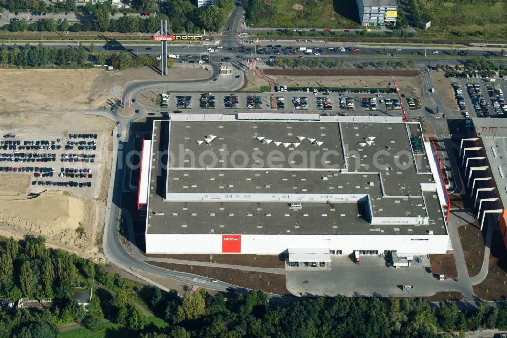 Aerial photograph Berlin - Building of the shopping center of Hoeffner Moebelgesellschaft GmbH & Co.KG and of Krieger-Gruppe on Landsberger Allee in Berlin Lichtenberg in the state Berlin, Germany