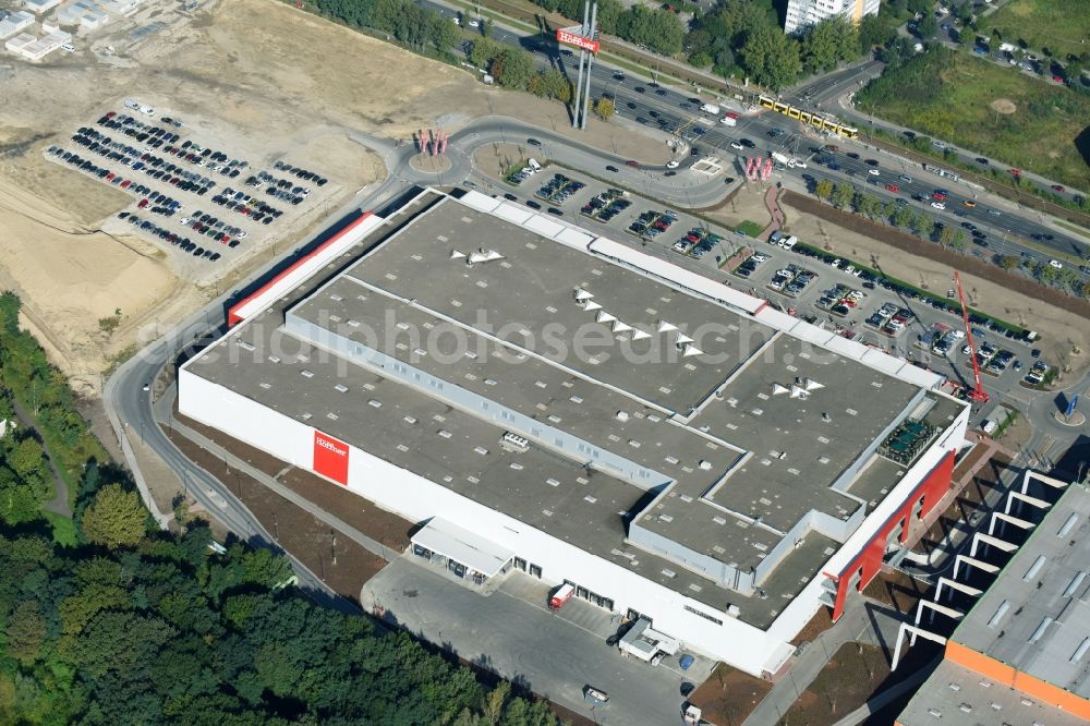 Berlin from the bird's eye view: Building of the shopping center of Hoeffner Moebelgesellschaft GmbH & Co.KG and of Krieger-Gruppe on Landsberger Allee in Berlin Lichtenberg in the state Berlin, Germany