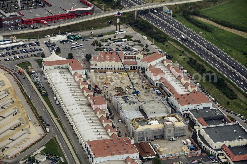 Aerial image Parndorf - Building of the shopping center Parndorf Fashion Outlet on the Gewerbestrasse in Parndorf in Burgenland, Austria