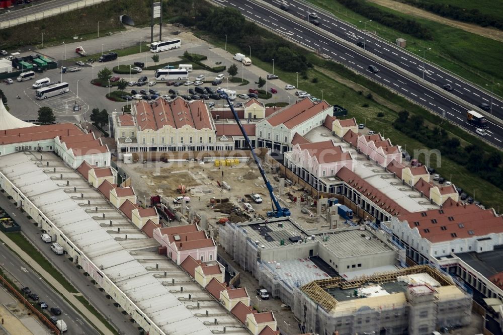 Parndorf from the bird's eye view: Building of the shopping center Parndorf Fashion Outlet on the Gewerbestrasse in Parndorf in Burgenland, Austria