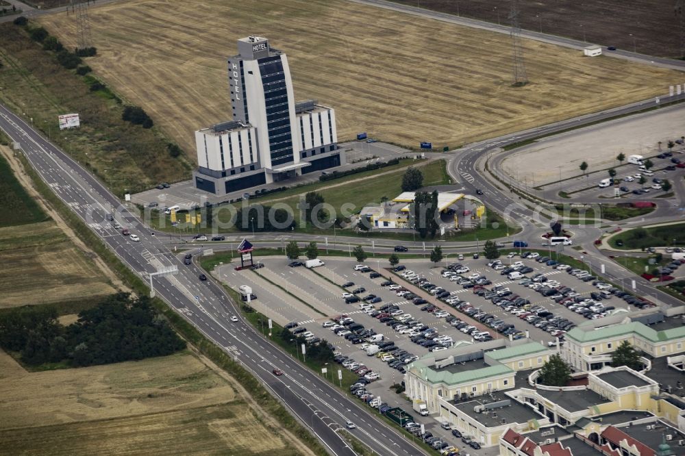 Parndorf from above - Building of the shopping center Parndorf Fashion Outlet on the Gewerbestrasse in Parndorf in Burgenland, Austria