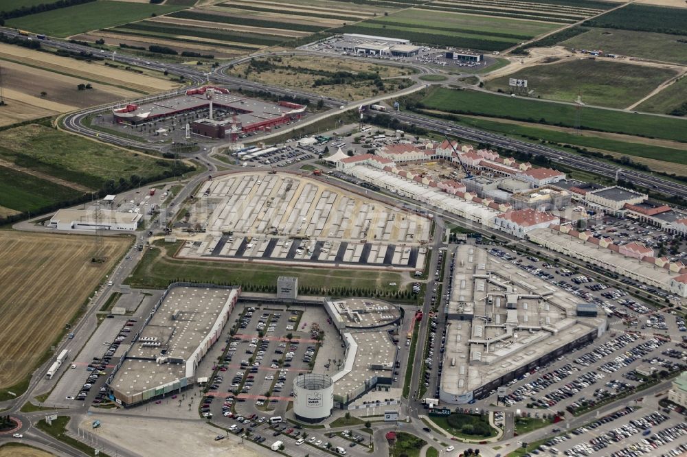 Parndorf from the bird's eye view: Building of the shopping center Parndorf Fashion Outlet on the Gewerbestrasse in Parndorf in Burgenland, Austria