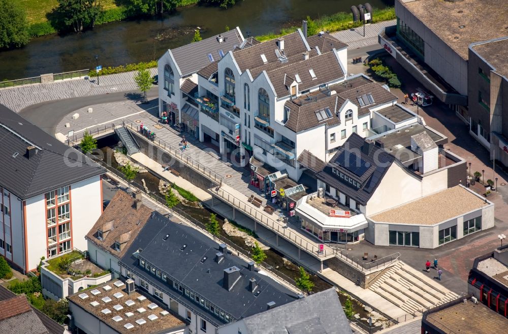 Meschede from the bird's eye view: Building of the shopping center Pressehaus with various commercial units on Winziger Platz in Meschede in the state North Rhine-Westphalia, Germany