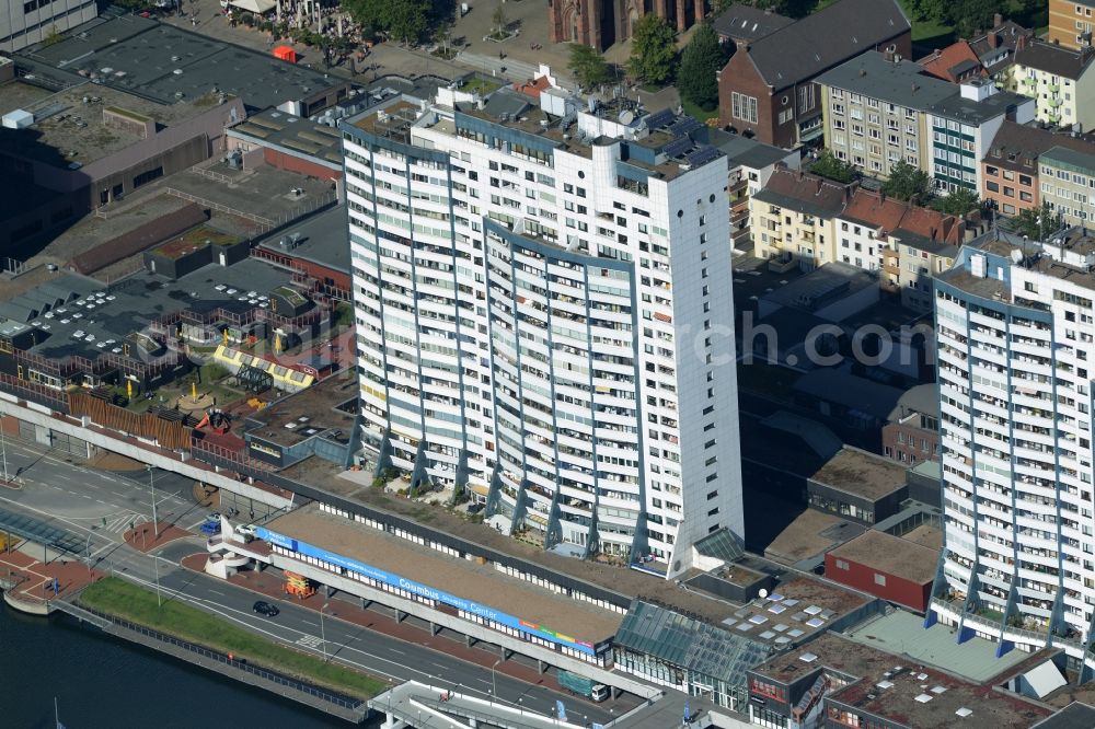 Bremerhaven from above - Building of the shopping center Columbus Shopping Center on the Old Harbour in Bremerhaven in the state of Bremen. The white high-rise complex is located on a pool of the harbour