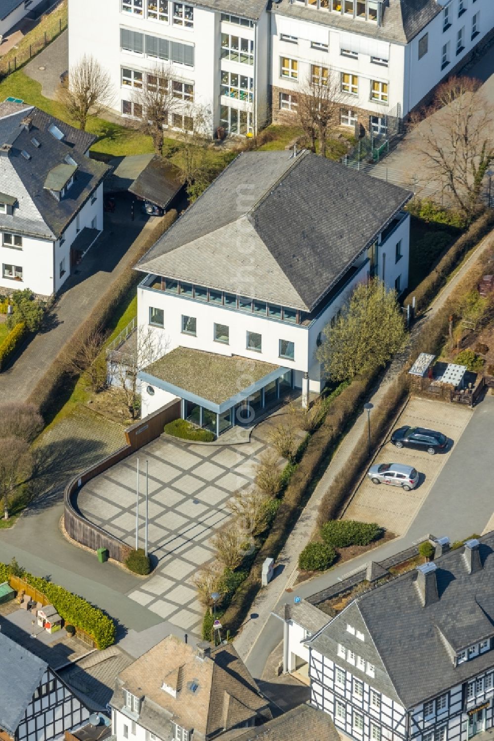 Schmallenberg from the bird's eye view: Building of the store - furniture market burgbad Aktiengesellschaft on Kirchplatz in Schmallenberg in the state North Rhine-Westphalia, Germany