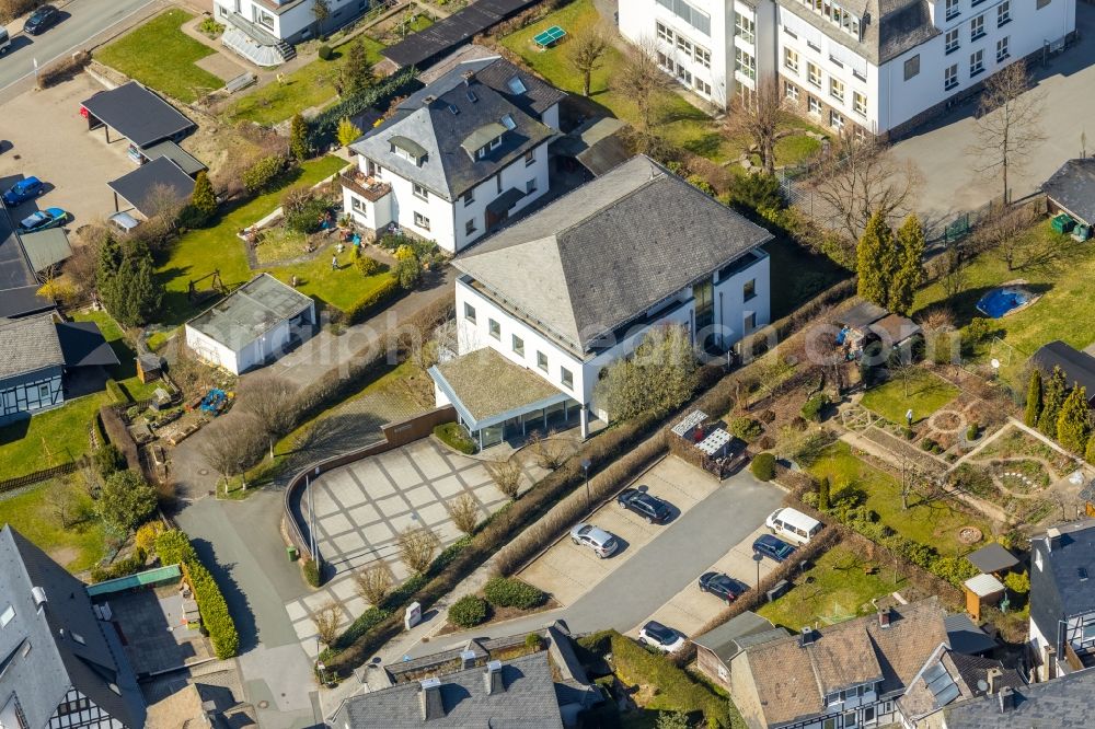 Aerial photograph Schmallenberg - Building of the store - furniture market burgbad Aktiengesellschaft on Kirchplatz in Schmallenberg in the state North Rhine-Westphalia, Germany