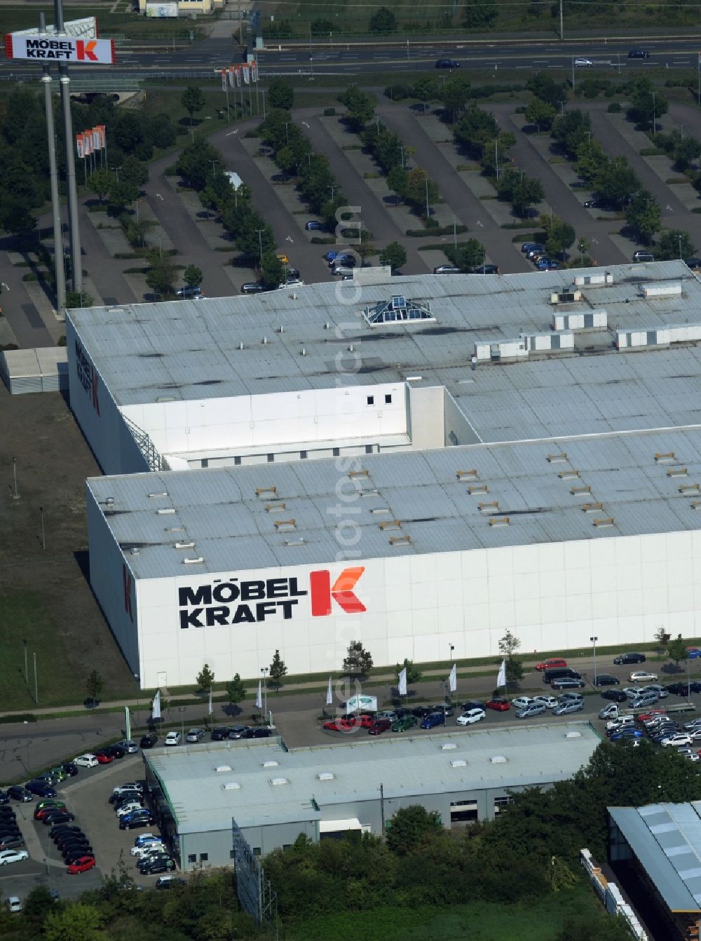 Aerial photograph Taucha - Building of the store - furniture market Moebel-Kraft Taucha GmbH & Co. KG in Taucha in the state Saxony