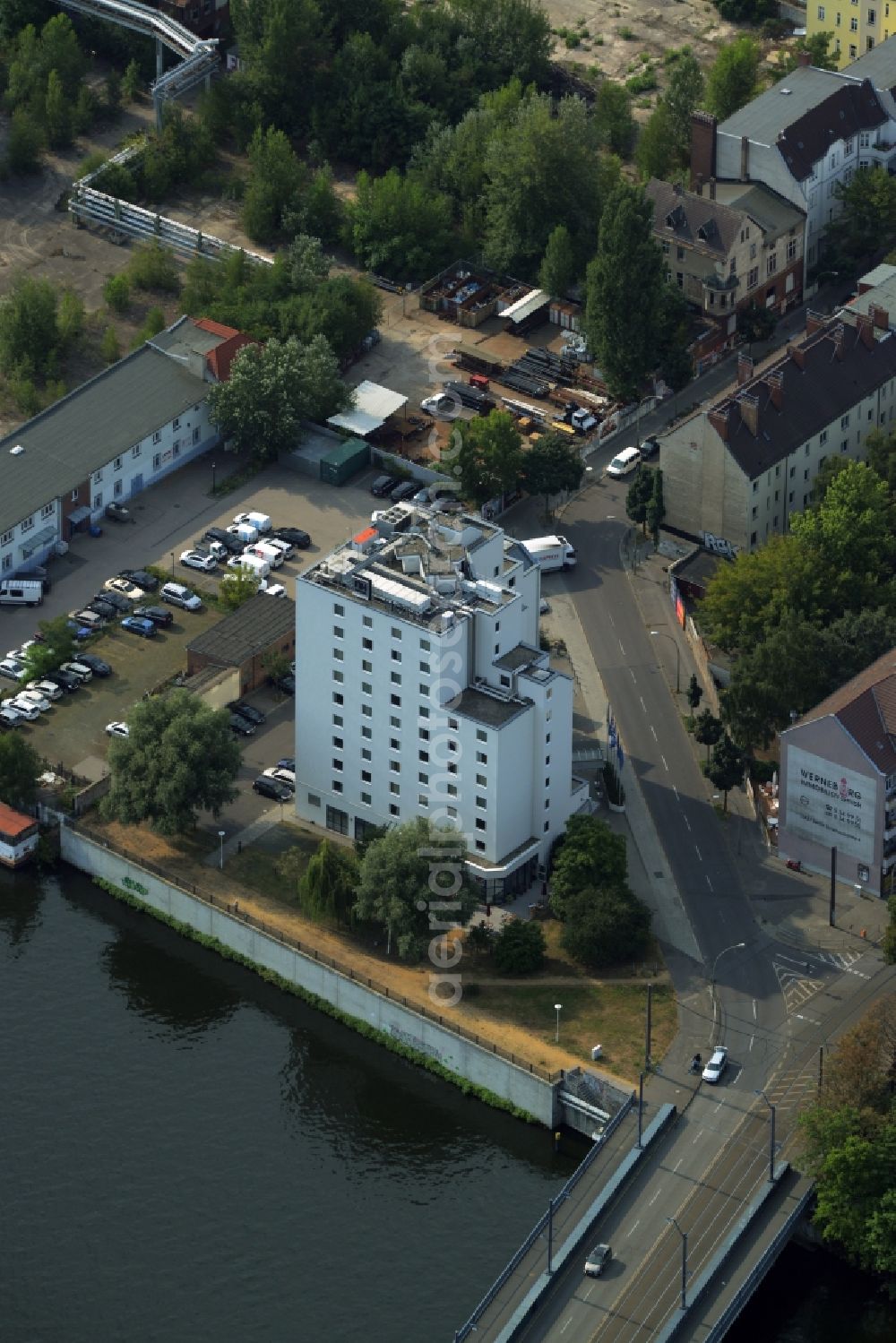 Aerial image Berlin - Hotel Building of the Hotel NH Berlin Treptow on the Spree riverbank in the Niederschoeneweide part of Berlin in Germany. The building with the white facade is located on Spreestrasse on the riverbank