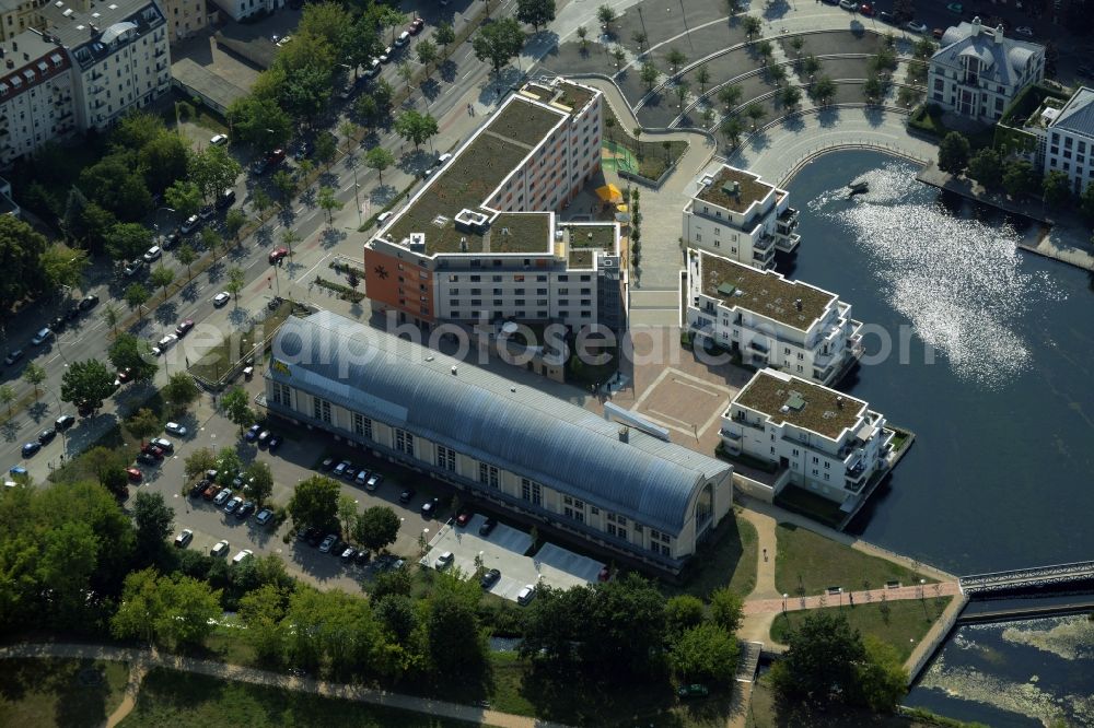 Berlin from the bird's eye view: Building of the Humboldt library and residential buildings on the harbour of Tegel in the district of Reinickendorf in Berlin in Germany. The building includes the town library