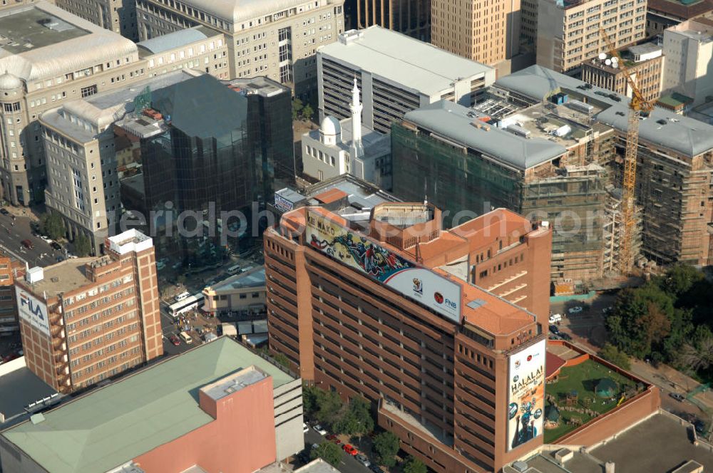 Aerial photograph JOHANNESBURG - The Joburg Road Agency is in possession of Johannesburg and is responsible for the road network and the stormwater infrastructure in the city. The T-shaped building in front is a commercial building on Diagonal Street, the main street of the business district of Johannesburg