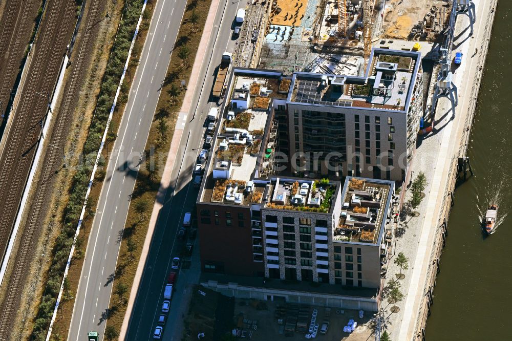 Hamburg from above - Building of a multi-family residential building on Baakenhafen on Norderelbe on street Versmannstrasse in the district HafenCity in Hamburg, Germany