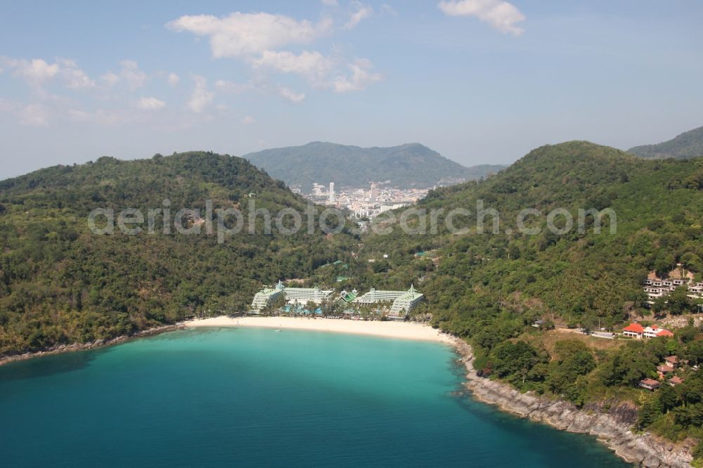 Karon from above - The Le Meridian Beach Hotel near Karon town on the island of Phuket in Thailand has its own sandy beach in an exclusive bay