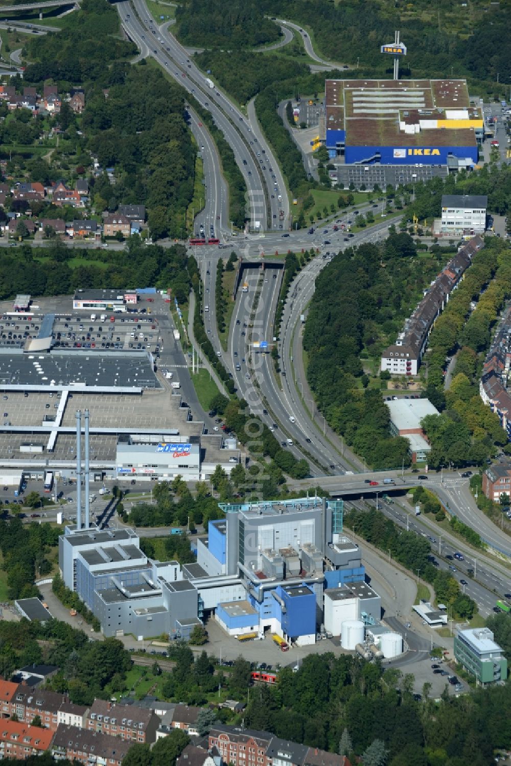 Aerial image Kiel - Building of the waste incineration plant and Shopping Mall Plaza Center in Kiel in the state of Schleswig-Holstein. The blue plant and the shopping mall are located on federal highway B76