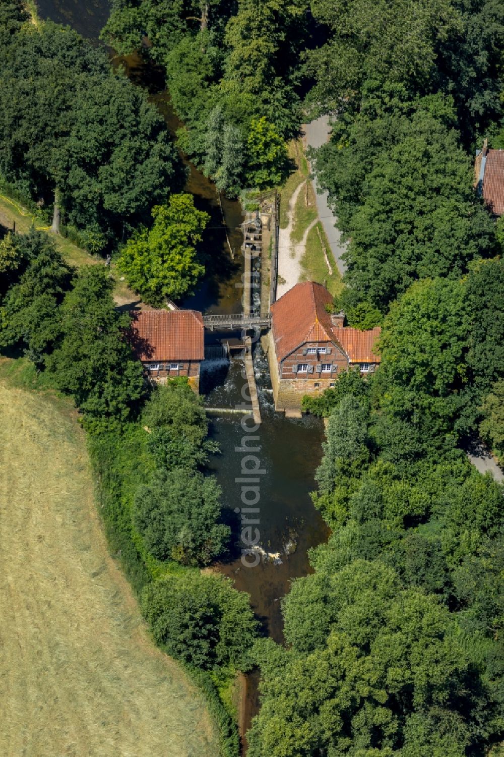 Telgte from the bird's eye view: Buildings and parks of the former manor Haus Langen with a water mill in Telgte in the federal state of North Rhine-Westphalia, Germany