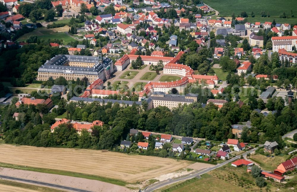 Wermsdorf from above - Building and Castle Park Castle Schloss Hubertusburg in Wermsdorf in the state Saxony. he Royal hunting residence Hubertus Castle of the Saxon elector and Polish King August III represents one of the most important castle complexes of the 18th century in Germany. The castle is now a museum