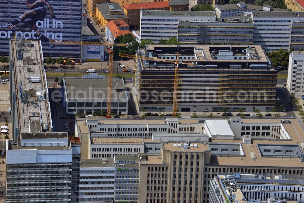 Berlin from above - Building complex in which the central service unit of the police is located and the police department 3 section 32. Behind the building the cranes stand on a construction area on which a housing complex is built with the project name Le Bijou. Project developper and builder is the WGFAG, later the buildings will be sold to an investor