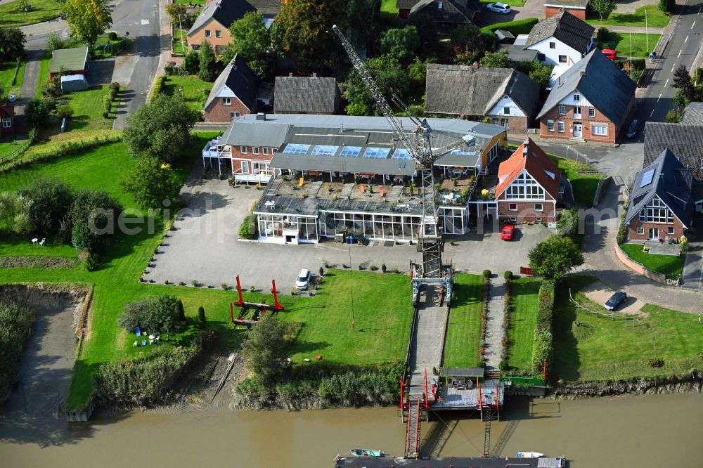 Geversdorf from above - Building of the restaurant Faehrhaus on Hauptstrasse in Geversdorf in the state Lower Saxony, Germany