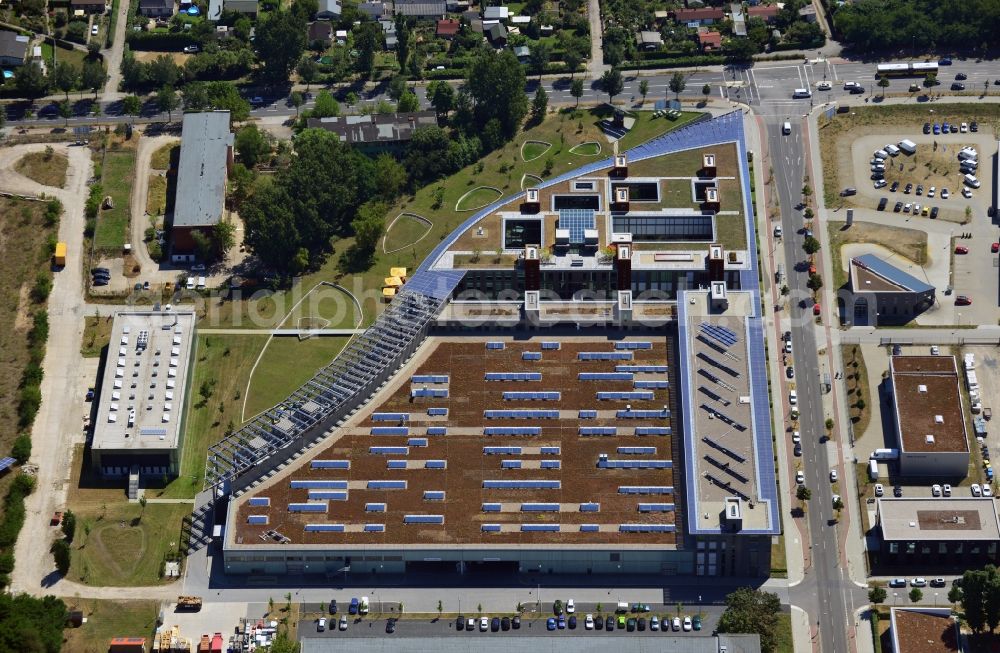 Aerial image Berlin - View of the administration and production building of the SOLON SE, one of the largest manufacturers of solar modules in Europe as well as a supplier of solar system technology for large-scale rooftop and greenfield installations. SOLON’s core business is producing solar modules and photovoltaic systems along with planning and constructing large rooftop installations and turnkey solar power plants all over the world