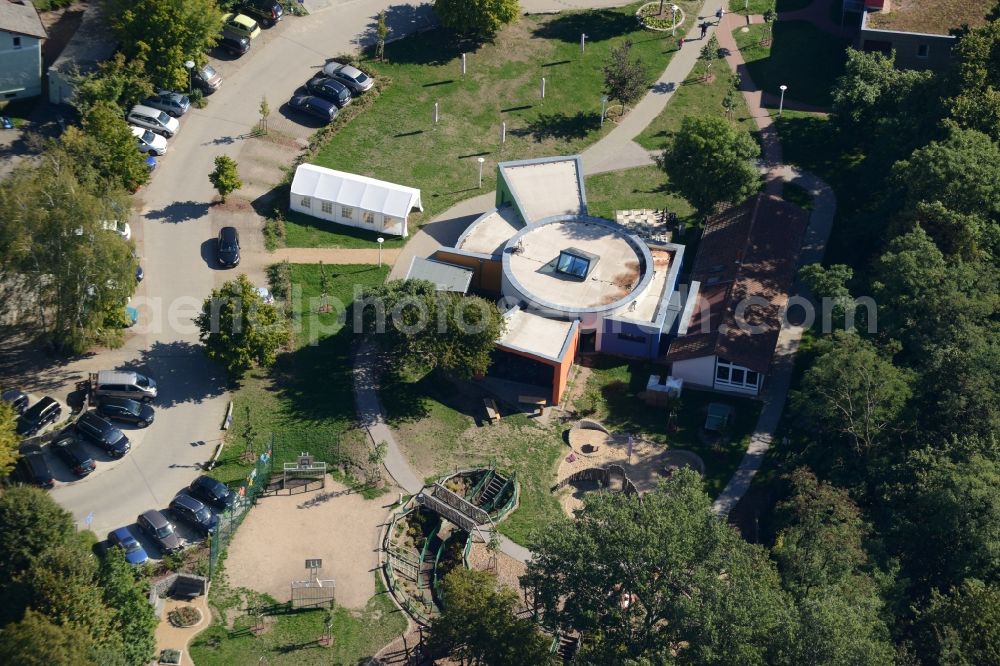 Aerial image Buckow (Märkische Schweiz) - Hospital grounds of the rehabilitation center in Buckow (Maerkische Schweiz) in the state of Brandenburg. The architectural distinct building includes a large playground