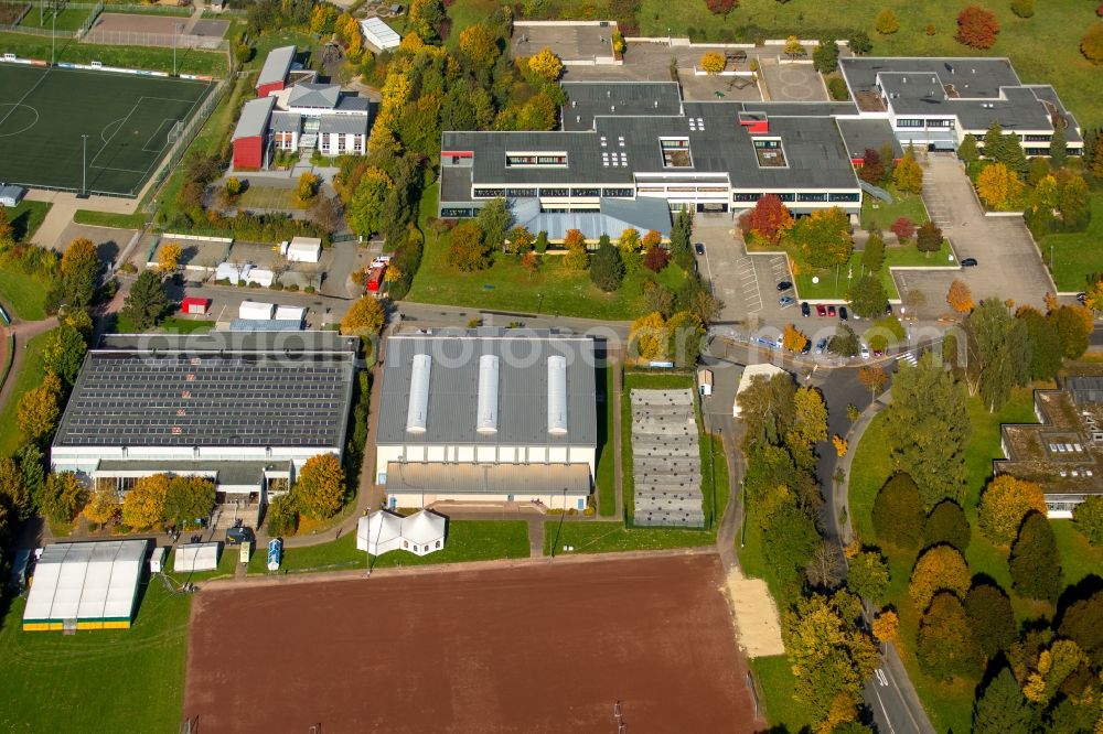 Aerial photograph Brilon - Roof on the building of the sports hall in Brilon in the state North Rhine-Westphalia. The object at the Carl-Diem-Weg is currently used as a makeshift refugee and Asylanten- accommodation