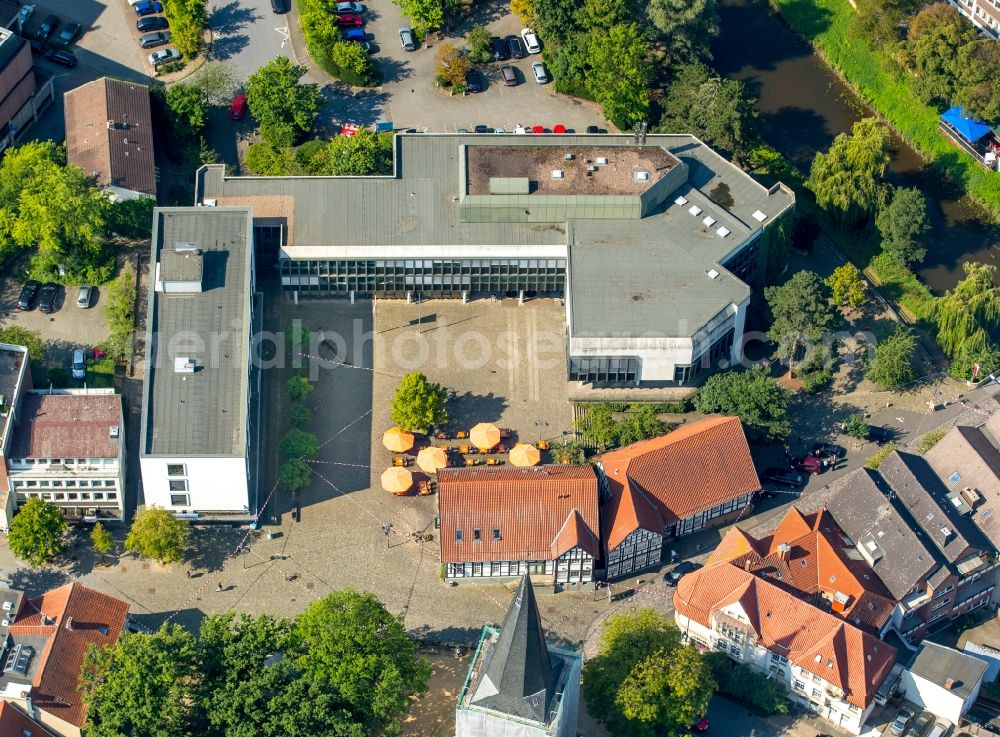 Bünde from above - Town Hall building of the city administration infornt of the restaurante Toro Blanco in Buende in the state North Rhine-Westphalia