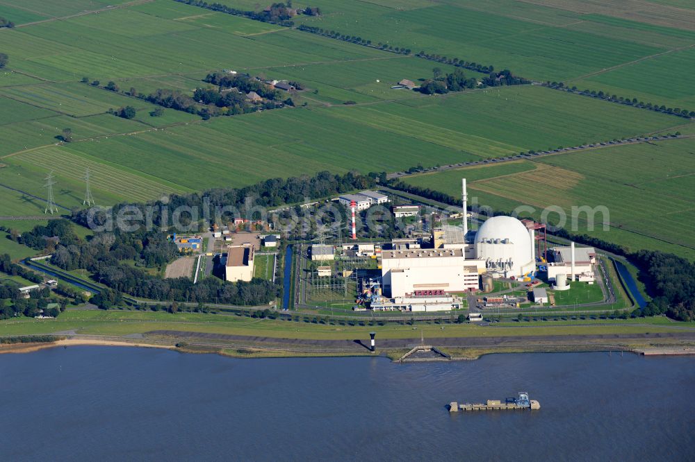 Brokdorf from the bird's eye view: Building the decommissioned reactor units and systems of the NPP - NPP nuclear power plant on elbe river in Brokdorf in the state Schleswig-Holstein, Germany