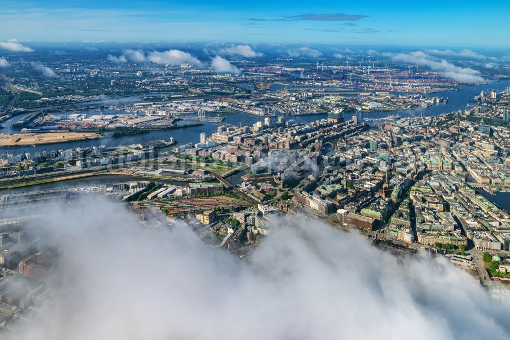 Hamburg from the bird's eye view: Buildings, streets and canals of the Hafencity and Speicherstadt above the clouds in Hamburg, Germany