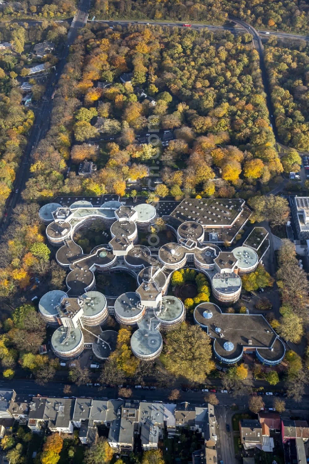 Duisburg from the bird's eye view: Building of the University of Duisburg-Essen in autumn forest in the Ruhr area in North Rhine-Westphalia