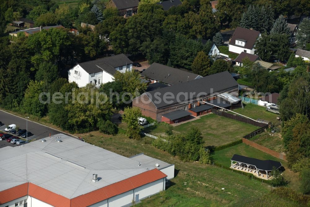 Werneuchen from the bird's eye view: Complex of the hotel, restaurant and event barn Annenhof in Werneuchen in the state of Brandenburg. The complex is located on Freienwalder Street