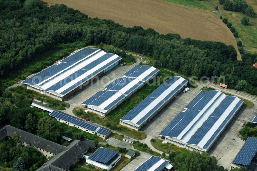 Alaunwerk from the bird's eye view: Complex and former munitions depots of Intent with photovoltaic solar systems warehouse building of the former barracks in Heide Alaunwerk in Saxony