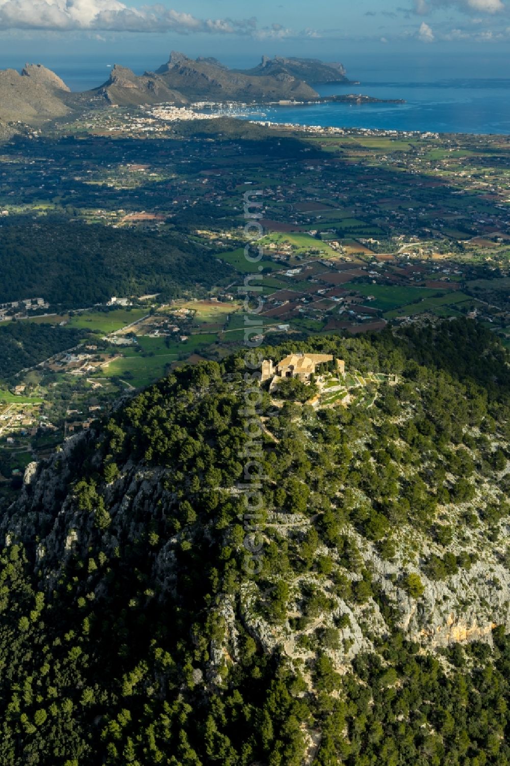 Aerial image Pollensa - Building complex of the former monastery and today hostel Santuari de la Mare de Deu del Puig in Pollensa in Islas Baleares, Spain