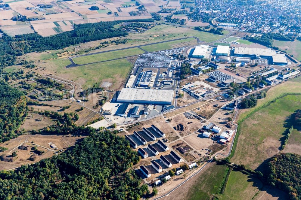 Erlensee from the bird's eye view: Building complex of the former military barracks Fliegerhorst to industrial estate with Dachser Food Logistics in Erlensee in the state Hesse, Germany