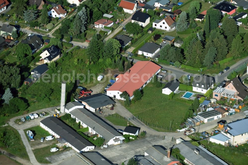 Bernau from the bird's eye view: Building complex and grounds of the automotive repair shop Wilhelm-Weitling-Strasse in Bernau in the state Brandenburg