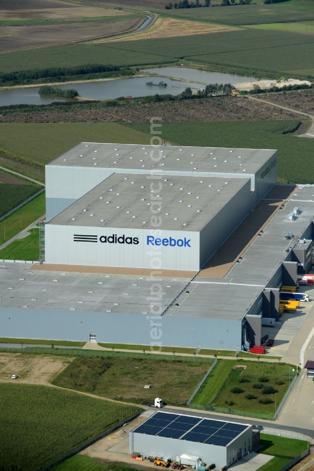 Aerial photograph Rieste - Building complex and grounds of the logistics center adidas Reebok in the industrial area Niedersachsenpark in Rieste in the state Lower Saxony