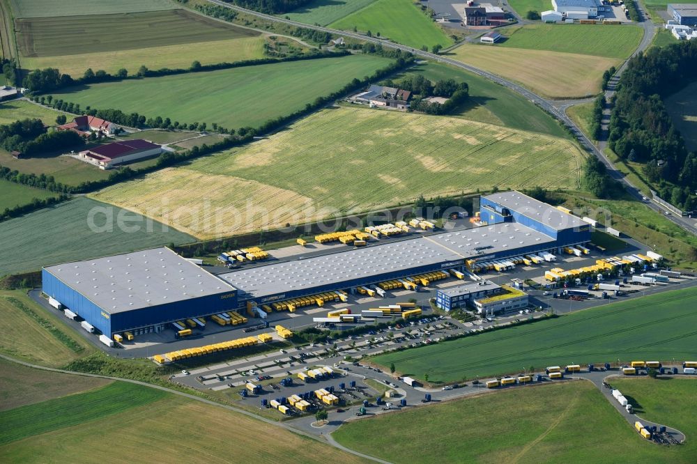 Feilitzsch from the bird's eye view: Building complex and grounds of the logistics center of DACHSER SE on Thomas-Dachser-Strasse in Feilitzsch in the state Bavaria, Germany