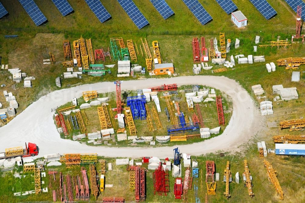 Neuenhagen from the bird's eye view: Building complex and grounds of the logistics center of K-M-V Krane GmbH Am Wall in Neuenhagen in the state Brandenburg, Germany