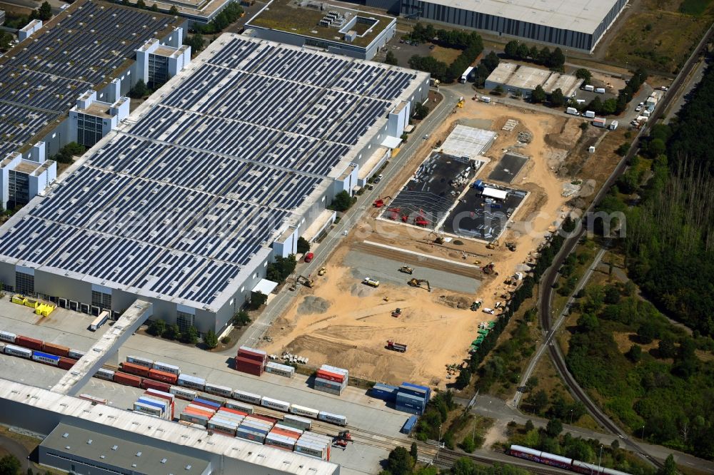 Leipzig from the bird's eye view: Building complex and grounds of the logistics center of the Logistikpark Leipzig Am alten Flughafen overlooking earthworks for development in Leipzig in the state Saxony, Germany