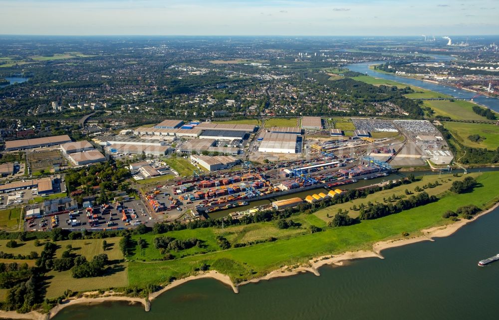 Aerial photograph Duisburg - Building complex and grounds of the logistics center logport on the left riverbank of the Rhine in Duisburg in the state of North Rhine-Westphalia. The center is part of the harbour duisport and located in the Rheinhausen part of Duisburg