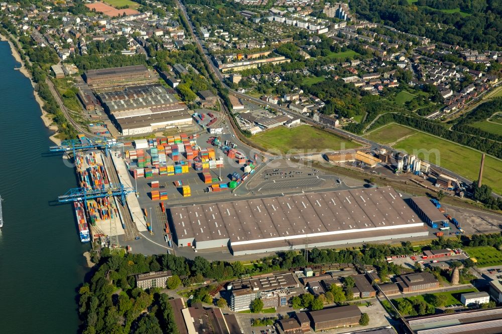 Duisburg from above - Building complex and grounds of the logistics center logport II on the right riverbank of the Rhine in Duisburg in the state of North Rhine-Westphalia. The center is located near Angerhausen where a container terminal is located