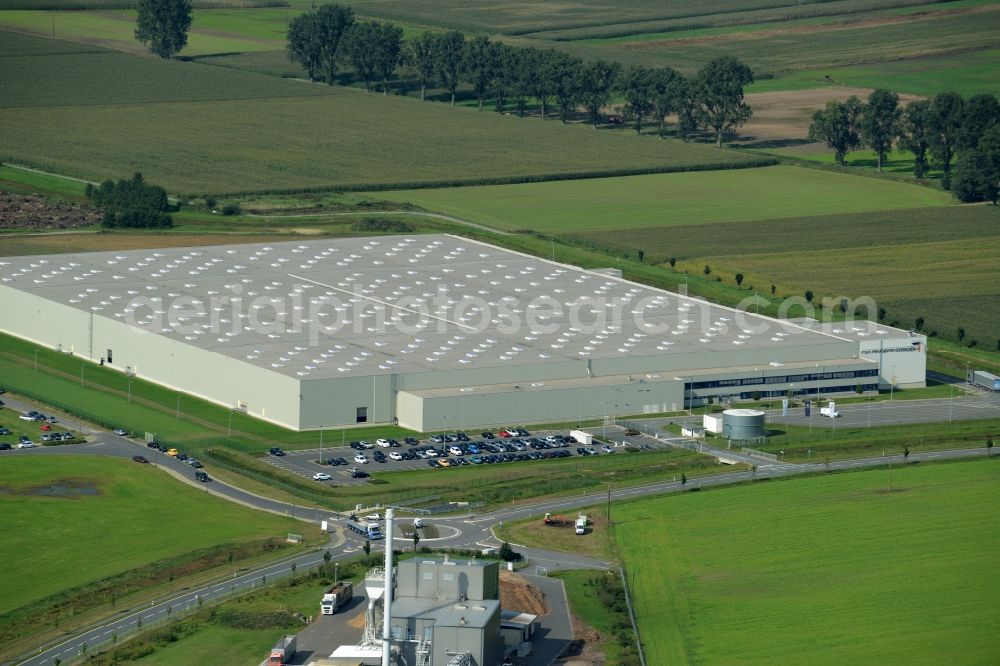 Rieste from the bird's eye view: Building complex and grounds of the logistics center der PSA Peugeot Citroën in the industrial area Niedersachsenpark in Rieste in the state Lower Saxony