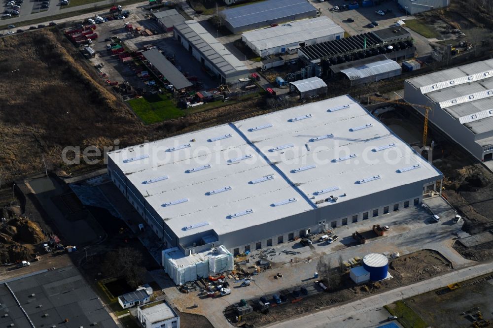 Hoppegarten from the bird's eye view: Building complex and grounds of the logistics center of Rhenus Home Delivery GmbH in of Industriestrasse in Hoppegarten in the state Brandenburg, Germany