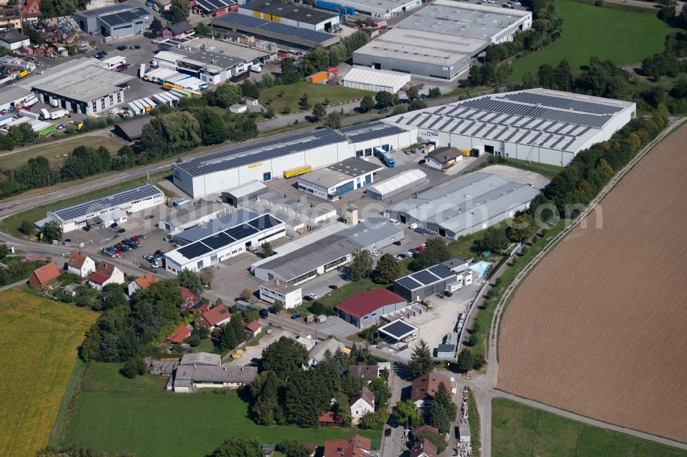 Ilsfeld from the bird's eye view: Building complex and grounds of the logistics center around the Schnaidwiesenweg in Ilsfeld in the state Baden-Wurttemberg, Germany