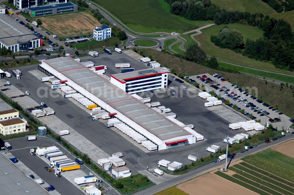 Ilsfeld from the bird's eye view: Building complex and grounds of the logistics center of Schenker Deutschland AG at the Robert-Kohlhammer-Strasse in Ilsfeld in the state Baden-Wurttemberg, Germany