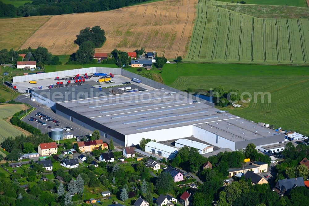 Schönfels from the bird's eye view: Building complex and grounds of the logistics center of Weck+Poller Holding GmbH in Schoenfels in the state Saxony, Germany